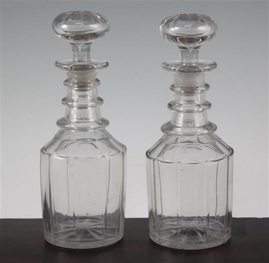A pair of glass mallet shaped decanters and stoppers, mid 19th century, 23cm.